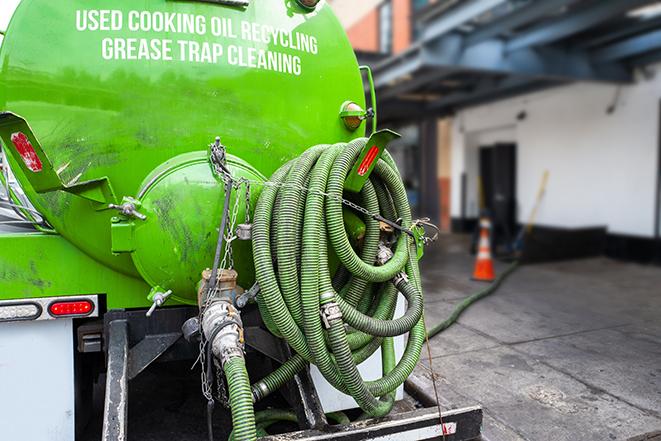 septic tank pump truck in operation in Allouez